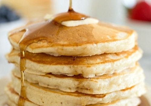Stack of pancakes with syrup at G Diner